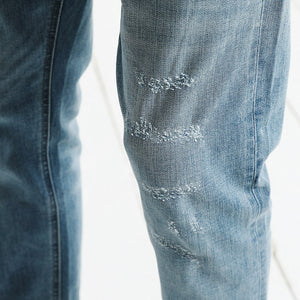 Scratched Light Blue Jeans